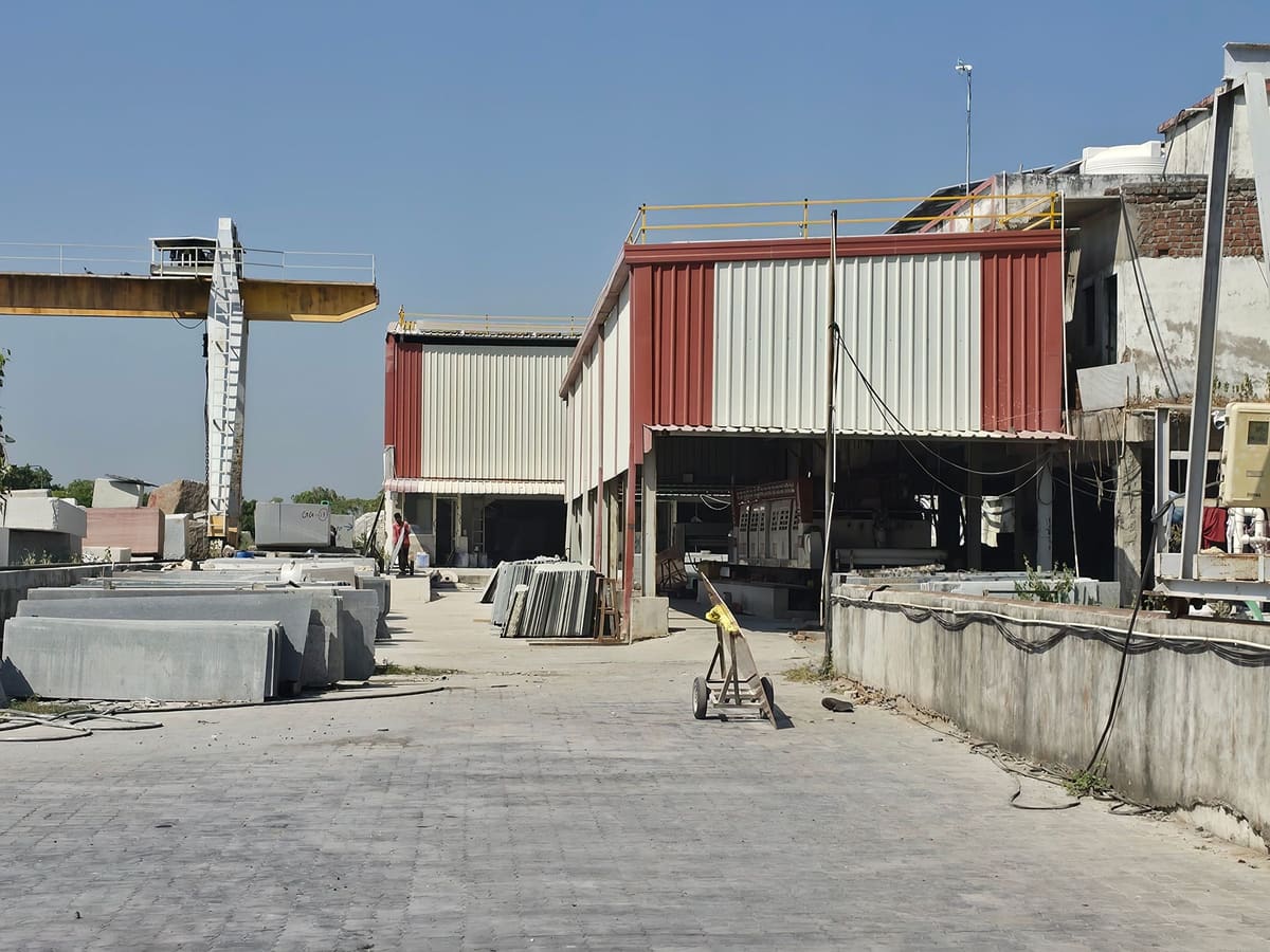 Gantry, sheds and stacked granite blocks at Selection Granite & Marble, Palanpur