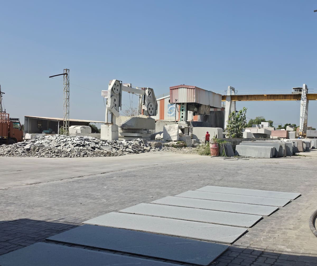 Gantry crane, cutter and granite blocks laid out in the yard at Selection Granite & Marble, Palanpur
